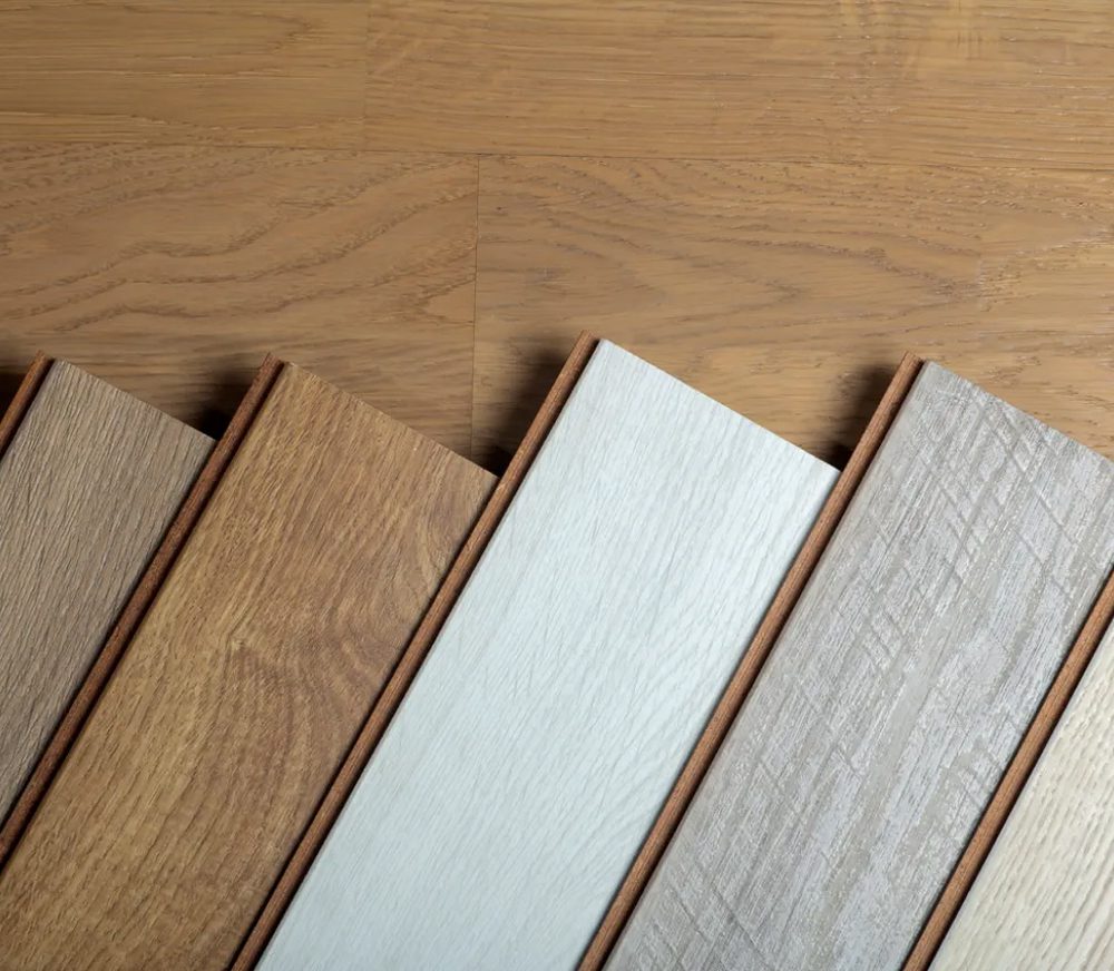 Wooden flooring samples in various shades.